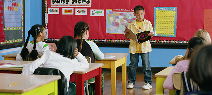 class-presentation Student giving a presentation in front of the class as an example of fun last day of school activities