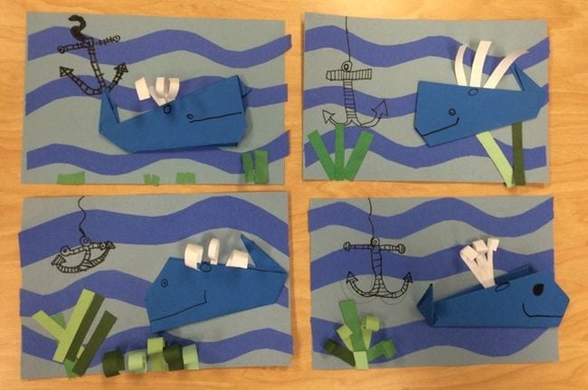 Second Grade Art: Origami Whales Paper origami whales on a blue construction paper background