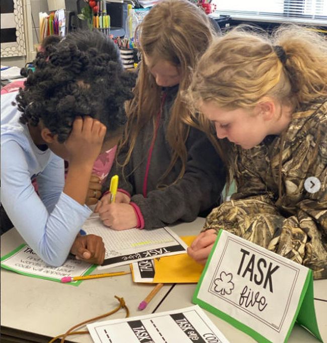 Classroom Escape Room Students solving a task in a classroom escape room