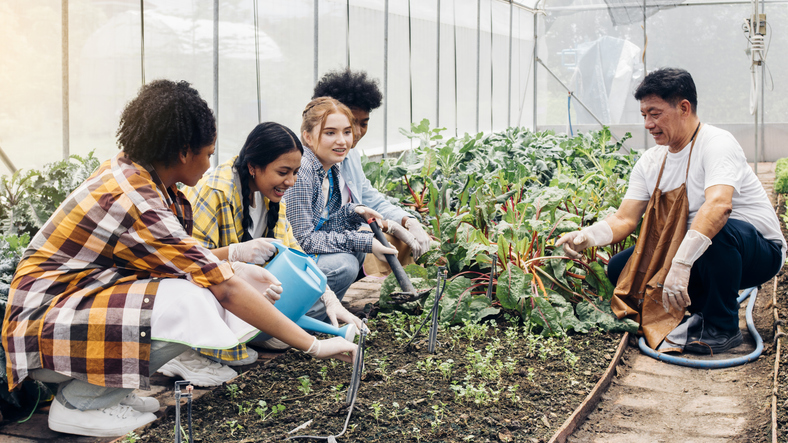 teen-garden Students working in a garden with their teacher as an example of job readiness skills