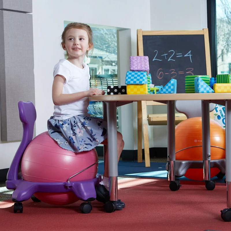 student sitting on a balance ball chair