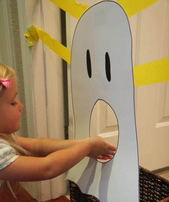 feed-a-ghost Young student feeding construction paper letters through a large paper ghost's mouth (Halloween Activities)