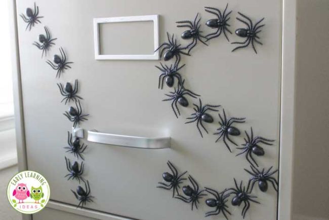 spider-magnets Plastic spider magnets on a filing cabinet spelling out I and S