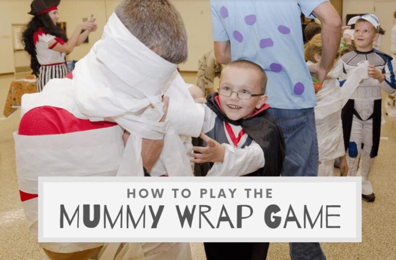 mummy-wrap-game Little kids are shown wrapping each other up in toilet paper (Halloween Activities)