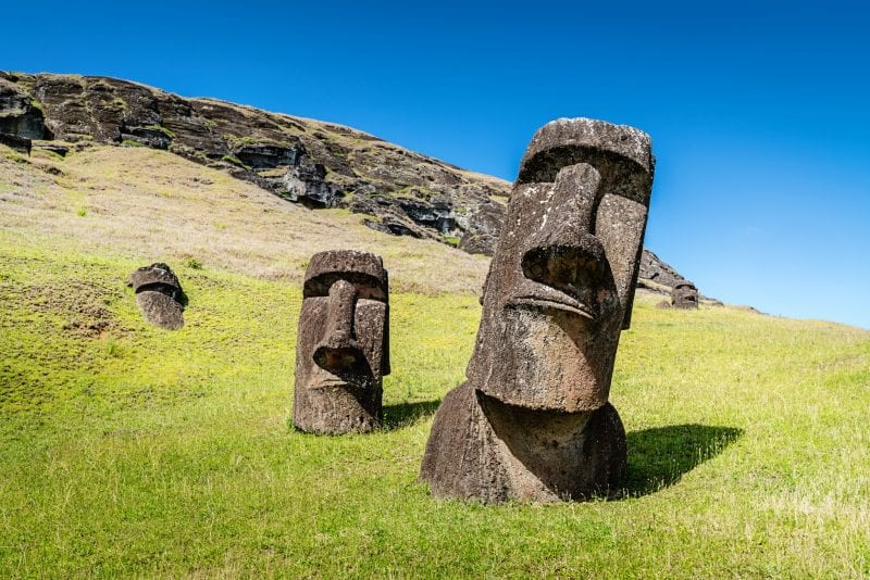 Easter Island Statues Rano Raraku Moais Rapa Nui Easter Island Moai Statues at Rano Raraku under sunny summer sky. Rano Raraku, Rapa Nui National Park, Hanga Roa, Easter Island, Chile.