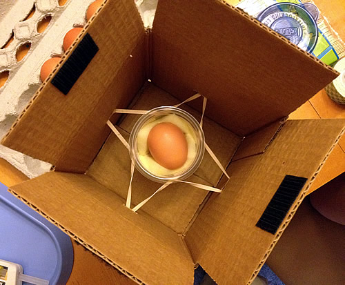 reinforcement-egg-drop egg in a box with a jar and rubber bands for an egg drop idea