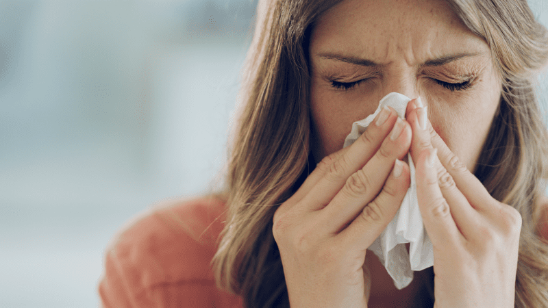 7 Signs You’re Teaching in a Sick School Building Woman sick with a cold