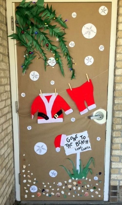 Winter Classroom Doors: Santa Clothes A classroom door is decorated with different items from Santa's suit.