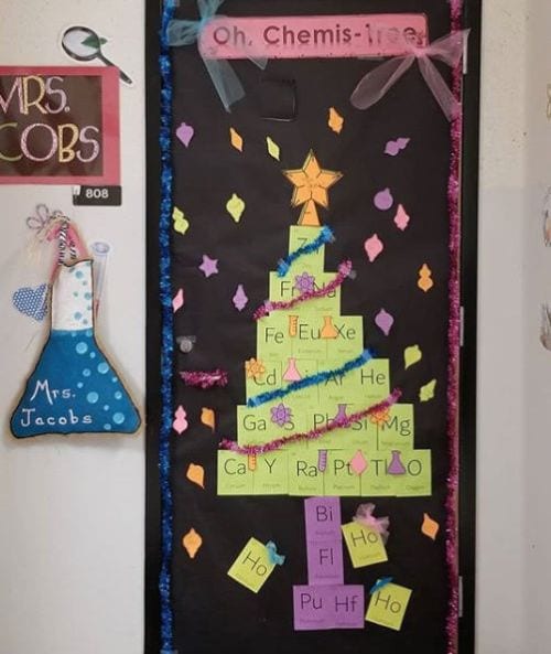 Winter Classroom Doors: Christmas Tree A door says Oh-Chemis-Tree and features a Christmas tree made up of the periodic table of the elements