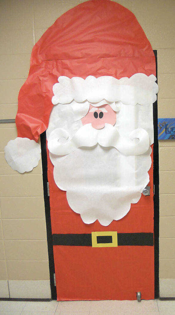 Winter Classroom Doors: Santa Holiday classroom doors include this one that is decorated to look like Santa Clause.