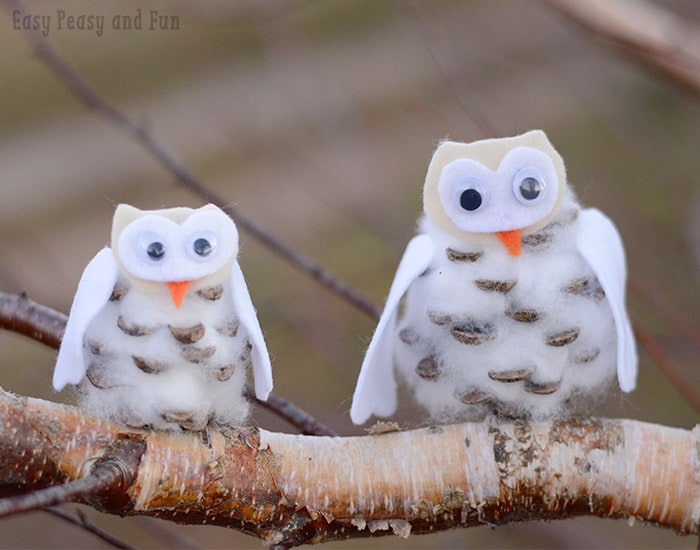 felted-owl Two DIY owls made from pinecones and cotton balls perch on a branch