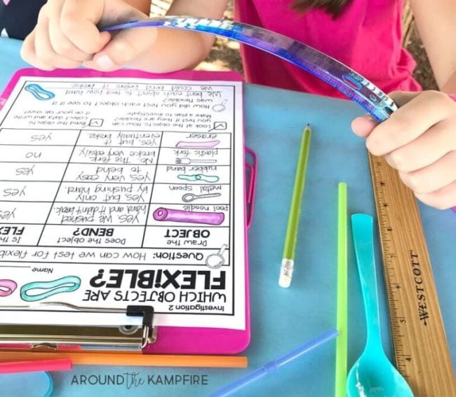 2nd Grade Science Around the Kampfire 5 Child's hands bending a blue plastic ruler