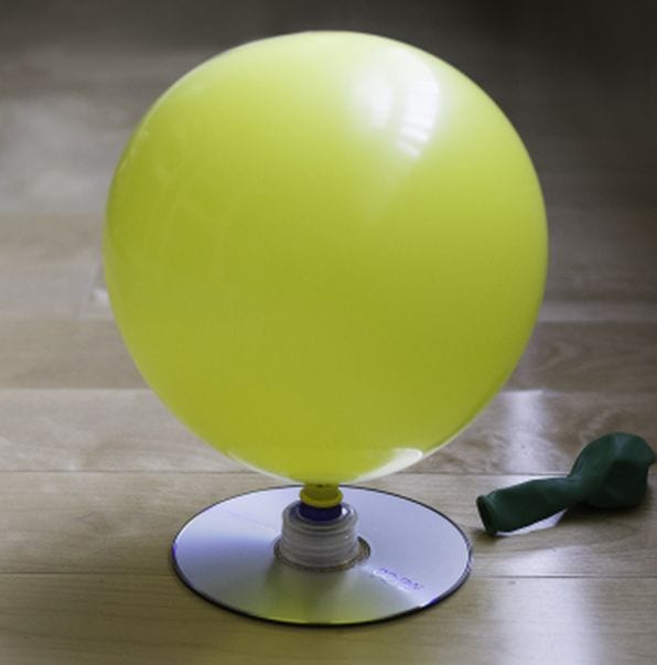 4th Grade Science Experiments Hovercraft Educationcom Inflated yellow balloon attached to a CD by a bottle cap