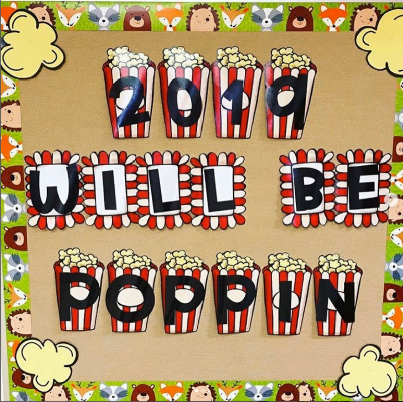 New Year Bulletin Poppin A brown bulletin board says 2019 will be poppin. There are boxes of popcorn underneath each of the letters.