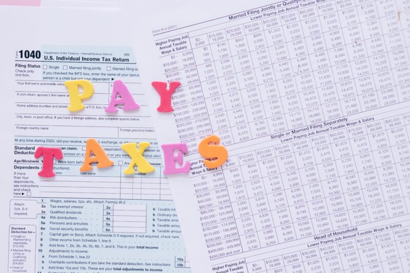 pay-taxes pay taxes written across tax forms