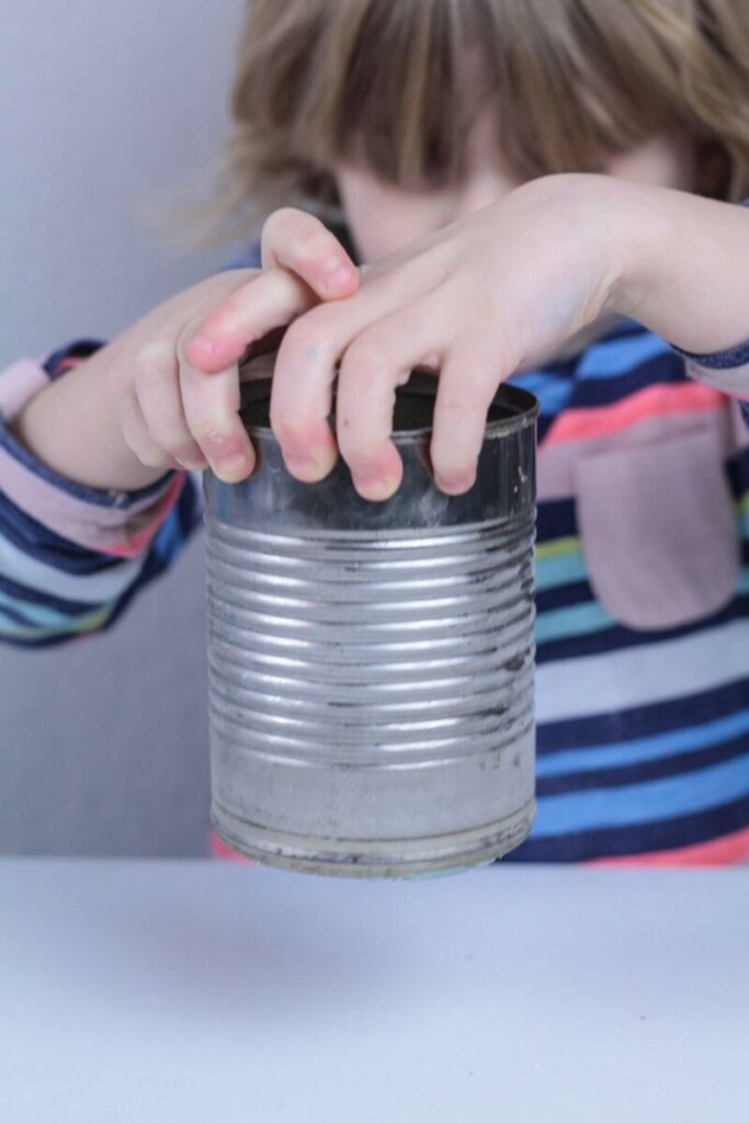frost-on-a-can child holding a can with frost on it