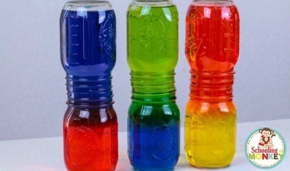 Water Density Experiment Colorful water in layers in double glass jars