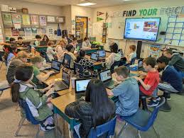 hour-of-code students working on coding for a fun friday idea