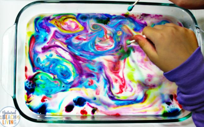 Kindergarten Science Activities; Magic Milk Student swirling a pan of colorful milk
