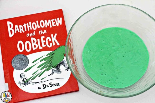 Kindergarten Science Activities Oobleck Bartholomew and the Oobleck book next to a bowl of thick green liquid