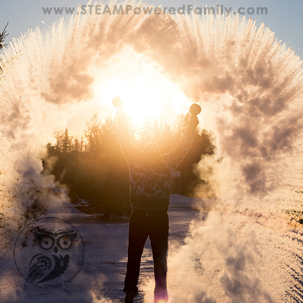make-snow man standing in the middle of frozen water