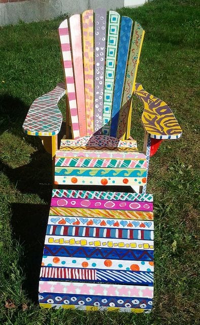 painted-adirondack A classic Adirondack chair painted by a group of students with different colors and patterns