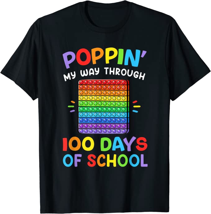 100th Day Shirt: Poppin 100th day of school shirt ideas include this black shirt that has a pop it fidget toy in rainbow colors. It says Poppin My Way Through 100 Days of School also in rainbow.
