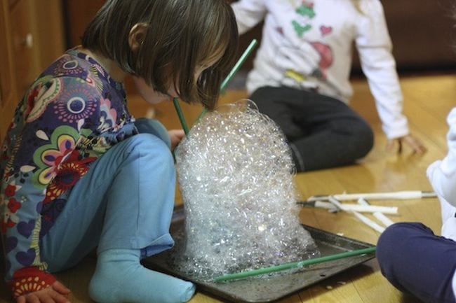 Bubble Towers Preschool science student blowing a tower of soap bubbles