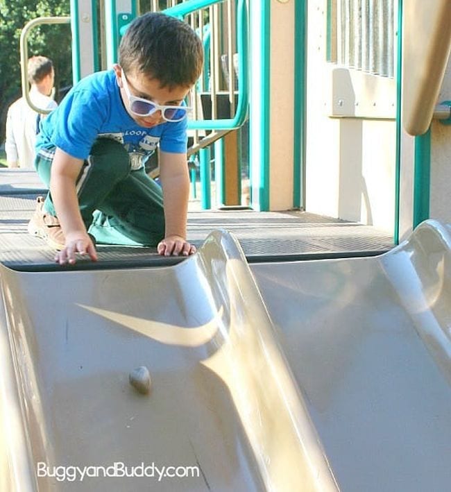 Preschool Science: Gravity and Friction Preschool science student sending a rock down a playground slide