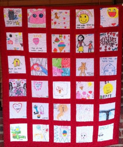 collaborative-classroom-quilt Squares created by individual students are quilted together on a red background