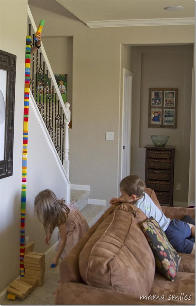 STEM Activities: Tall Tower Children building a tower to the ceiling using building blocks