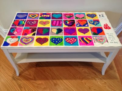 tile-table A white coffee table with hand painted heart tiles inlaid on the top