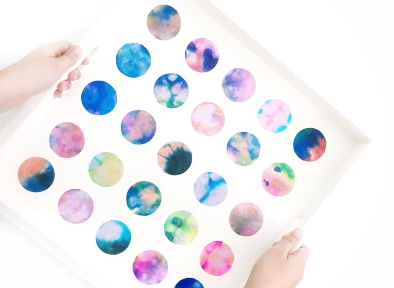 dot-tray A white serving tray decorated with hand-painted watercolor dots as an example of school auction art projects