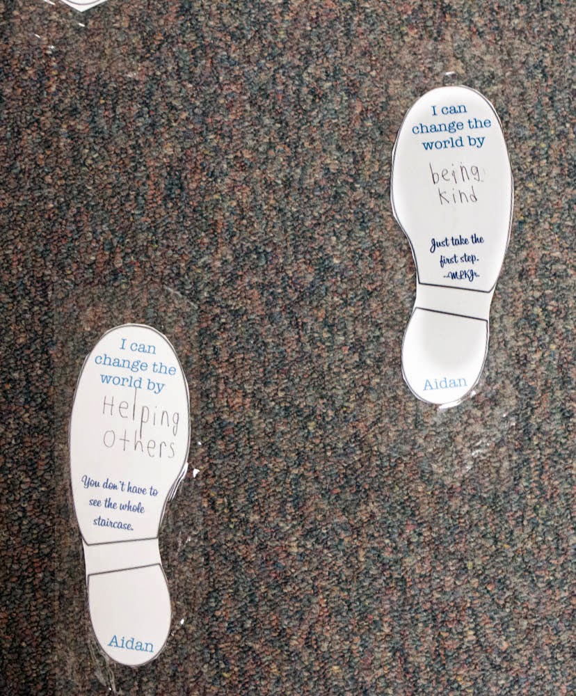 Martin Luther King Activities: Footsteps Foot prints taped to the floor with inspiring Martin Luther King Jr quote and kids' ideas for how they can change the world for the better