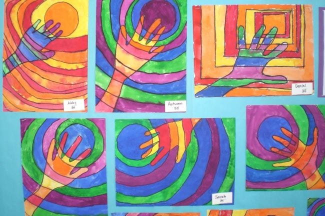 Third Grade Art Projects Warm and Cool Hands Third grade art projects include these drawings of hands with circles behind them in different colors.