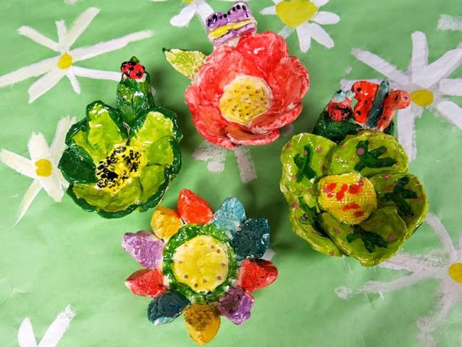 Third Grade Art Ceramic Flowers Third grade art projects include simple ceramic flower bowls with bugs and butterflies