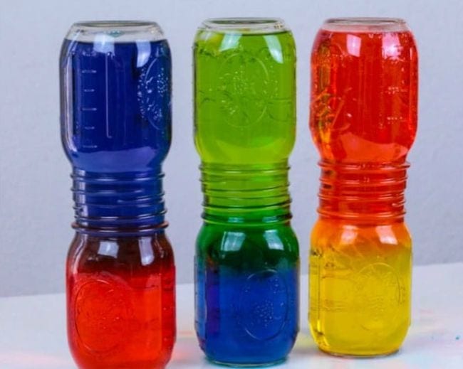 5th Grade Science Steamsational Mason jars stacked with their mouths together, with one color of water on the bottom and another color on top