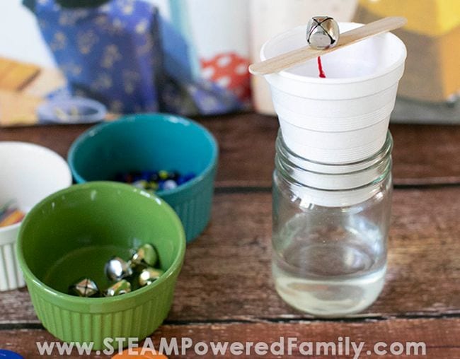7th Grade Science Steam Powered Family Several small bowls next to a water clock made from a jar of water, styrofoam cup, wood craft stock, and jingle bell