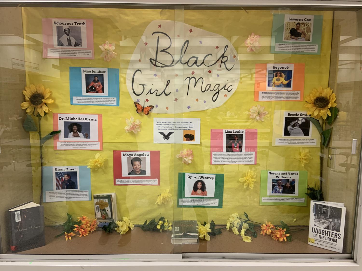 Black History Bulletin Board – Black Girl Magic A yellow board has text that reads Black Girl Magic. It has photos and descriptions of famous Black women on it (black history month bulletin board)