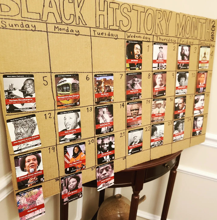 Black History Month Bulletin Board – Calendar Text Reads Black History Month. It is setup to look like a calendar. There is a card with a different person attached to each day of the month.