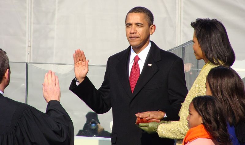 Barack Obama Inauguration Barack Obama being sworn in as President of the United States of America, standing next to his wife Michele
