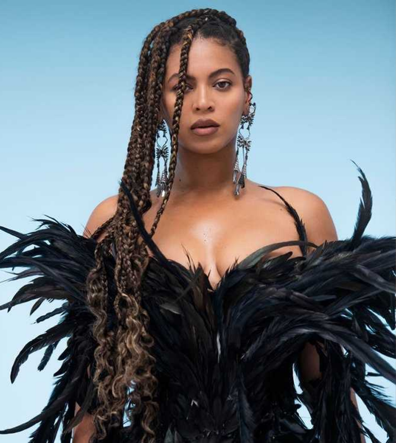 35 Famous Black Americans Everyone Should Know Beyonce in black feather dress with long braids