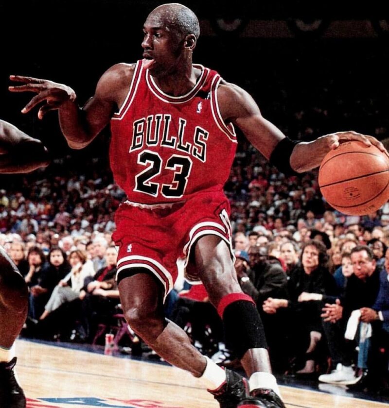 35 Famous Black Americans Everyone Should Know Michael Jordan in Chicago Bulls uniform playing basketball