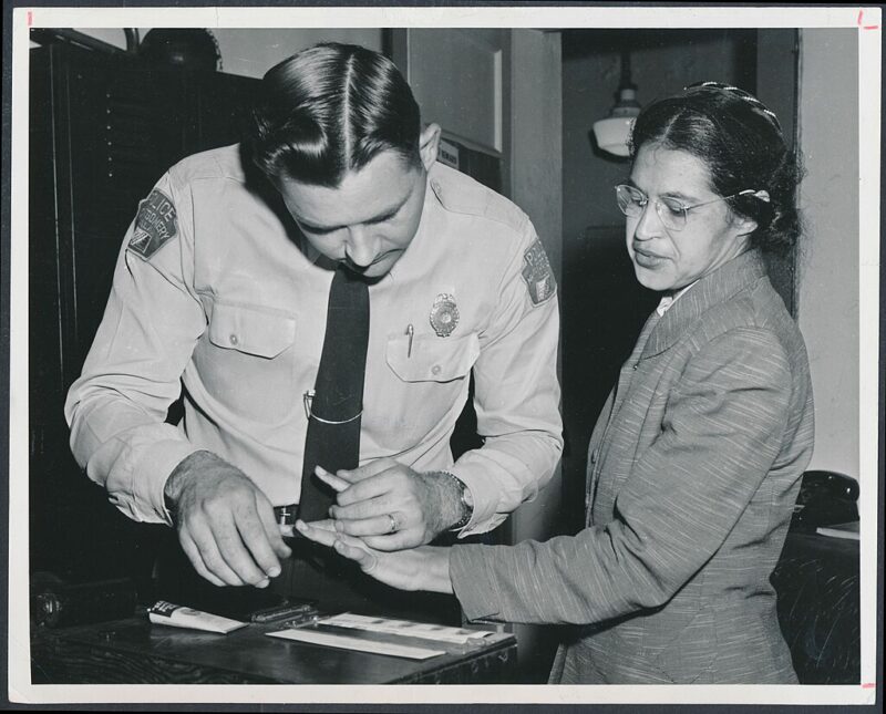 35 Famous Black Americans Everyone Should Know Rosa Parks being booked after being arrested, an example of famous Black Americans everyone should know