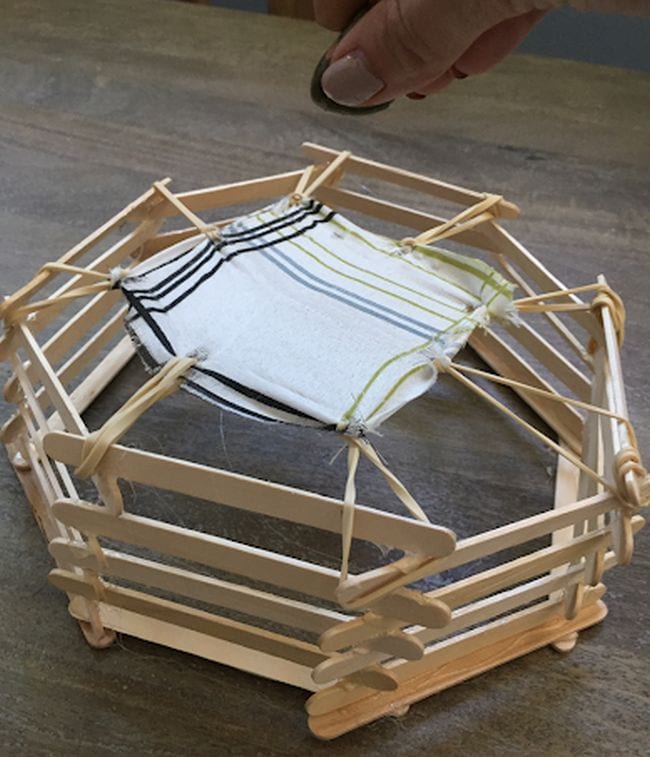 Fifth Grade Science STEM Trampoline Miniature trampoline built from wood craft sticks, rubber bands, and fabric (Fifth Grade Science)