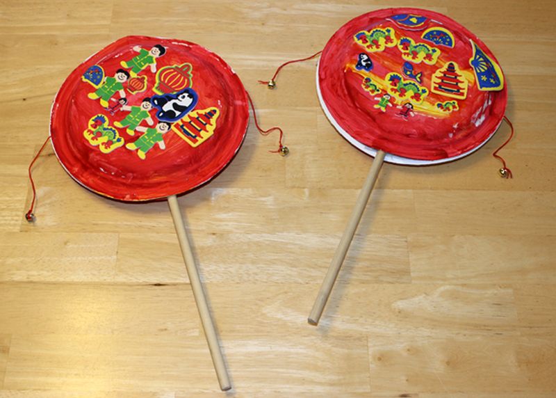 Lunar New Year: Chinese Pellet Drums Chinese pellet drums made from paper plates, string, and wooden dowels