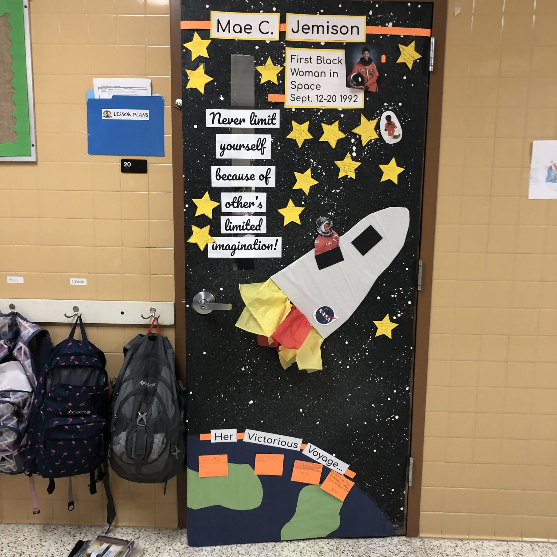 Black History Month Bulletin Board – Astronauts Mae A classroom door has a rocketship on it shooting off from Earth. It says Mae C. Jemison. Text reads