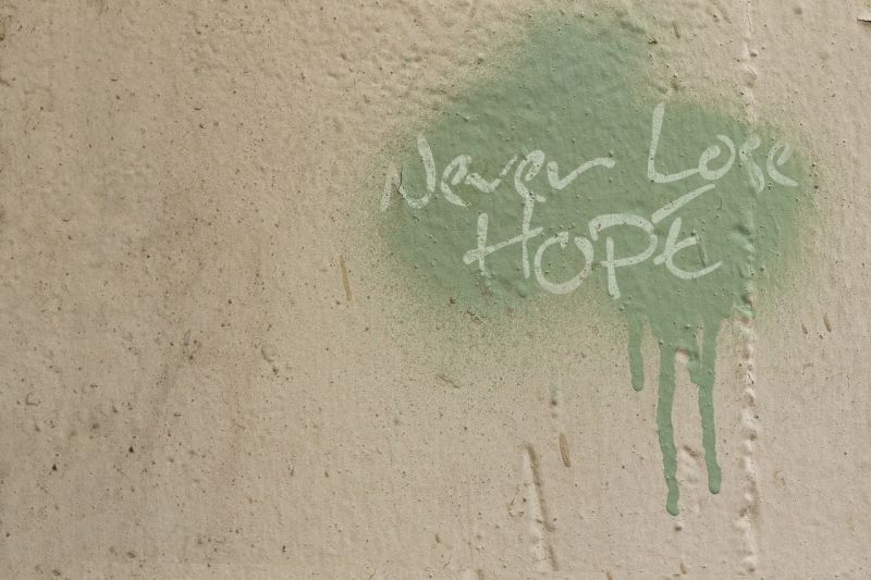 Writing Prompt: Never Lose Hope Splotch of green paint with the words