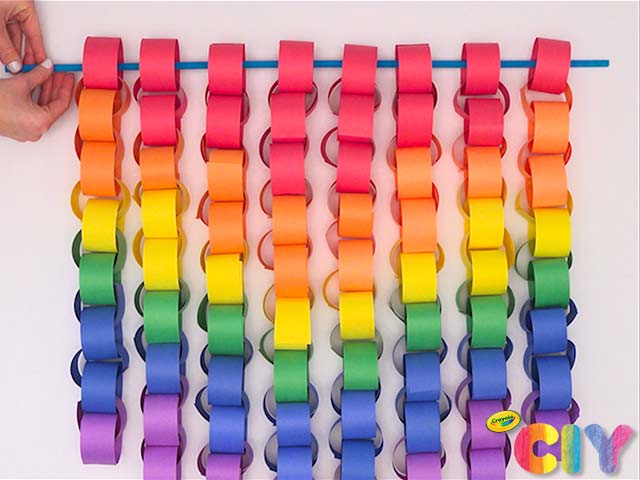 paper-chain A bright, colorful paper chain hangs from a dowel