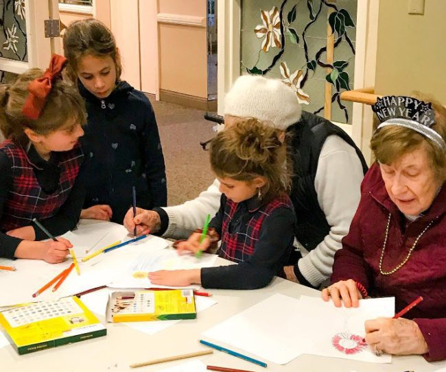 Project Based Learning Ideas: Kids and Seniors Children and senior citizens working on an art project together